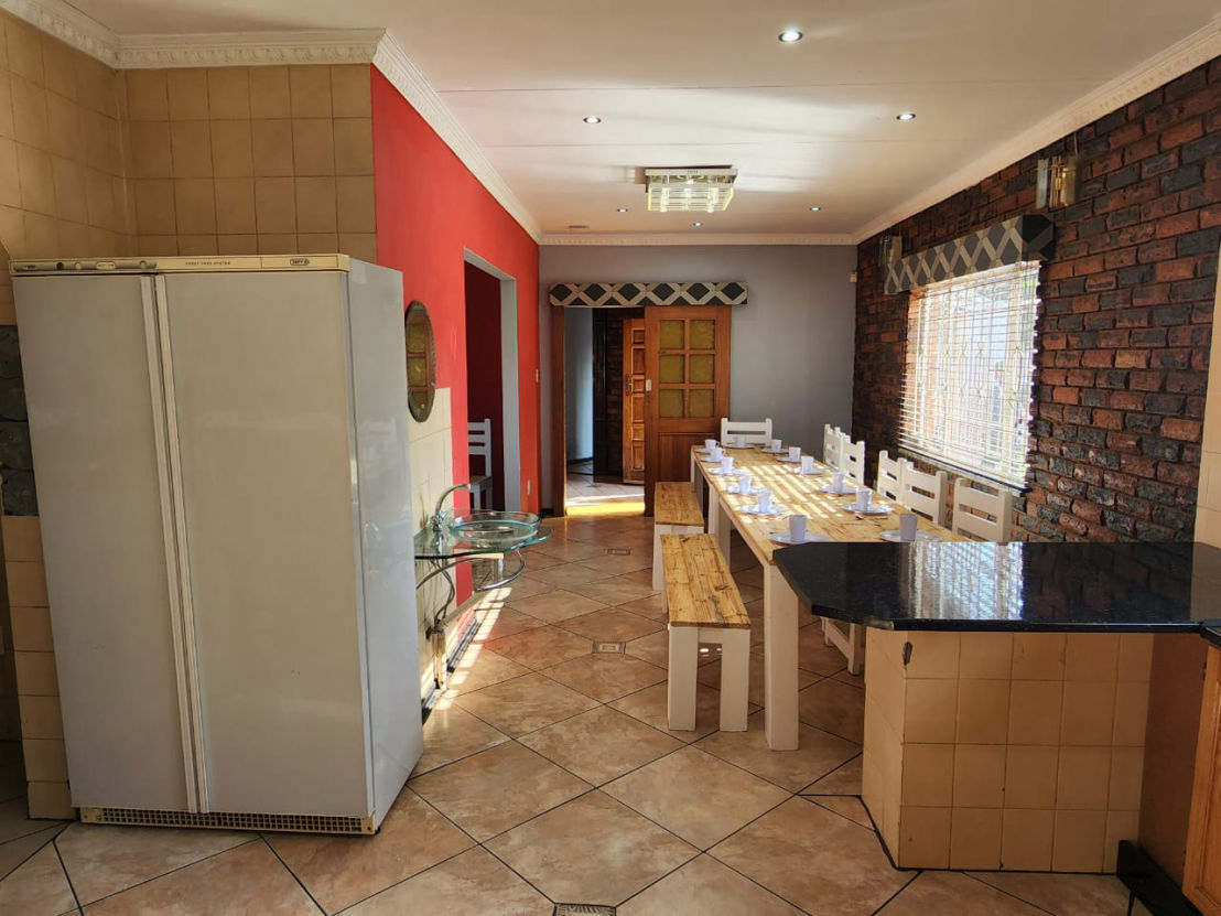Long view of the dining table from the kitchen in the Chester Haven Recovery Centre Facility